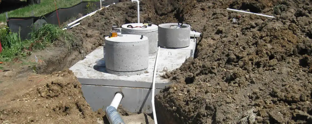 Septic system repair and installation site with tank access ports in Virginia Beach, VA