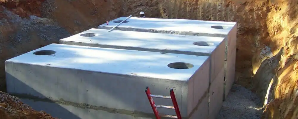 Septic tank installation site with a newly placed concrete tank in Virginia Beach, VA